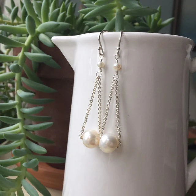 White Floating Pearl Earrings in Silver